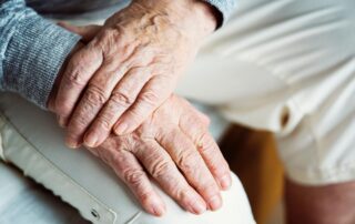 Elderly hands in a lap