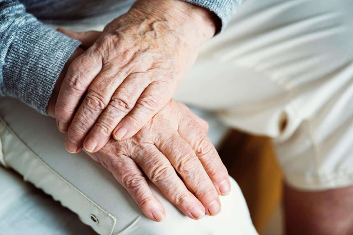 Elderly hands in a lap